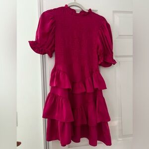 A pink karlie dress that zips in the back, it’s also high neck and fittted top